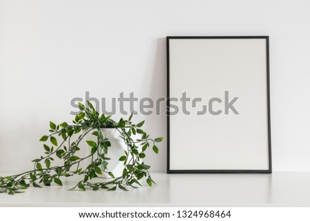 Poster frame and ivy house plant. Modern interior minimal mock up.