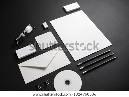 Photo of blank stationery set on black paper background. Corporate identity template. Branding mock up.