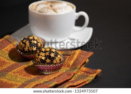 Chocolate Sweets Covered with Candy Stars. Handmade Candies and Cup of Coffee with Marshmallow on Dark Background. Tasty Luxury Dessert