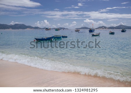 
fishing village in vietnam with boats and nets