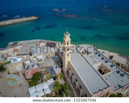 Bell tower of St. Peter's Church with the  mediterranean sea view in Jaffa, Tel Aviv, Israel. Aerial view