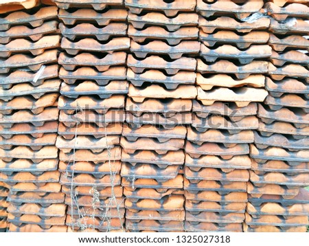 Folded roof tiles. Warehouse materials. Texture. Abstract background.
