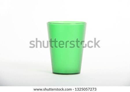 Green plastic glass isolated on white background -  Photostudio shooting