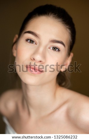 Portrait of young beautiful girl with natural makeup