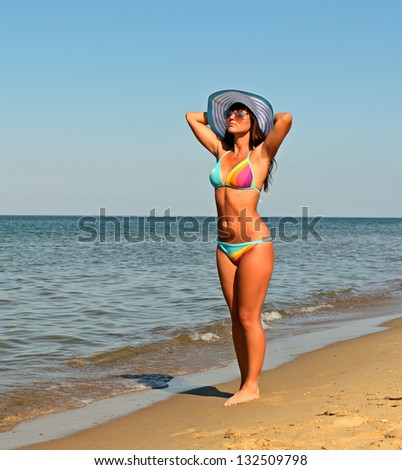 Beautiful girl in bikini basking in the sun