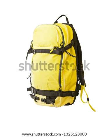 Side view of yellow backpack with straps for trekking, ski tours, hiking, etc. Sport equipment isolated on white background