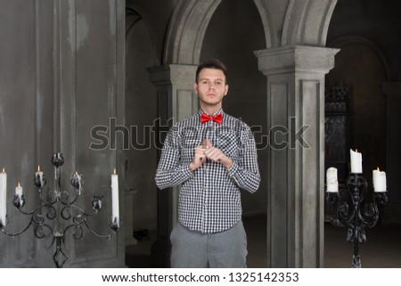 Prayer and sins. Young attractive guy in the church. 