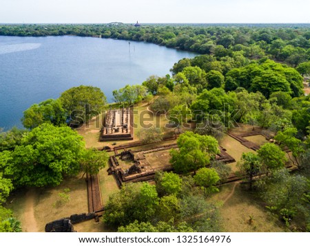 Palace Complex of King Nishshanka Malla (Nissanka Malla, Kirti Nissanka or Kalinga Lokesvara), Polonnaruwa, Sri Lanka, Asia. Mausoleum. Ruins overgrown by jungle. Shore of Bendiwewa lake.