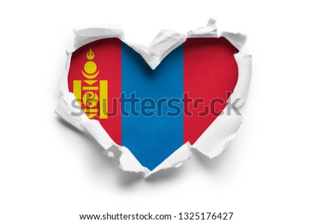 Heart shaped hole torn through paper, showing satin texture of flag of Mongolia. Isolated on white background