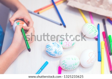 Easter eggs painted by child by hand. Easter ideas. Space for text. Happy easter.Toned image.