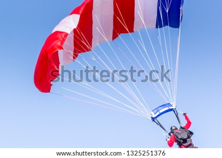 Skydiver with parachute with amarican colors