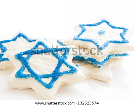 Gourmet cookies decorated with white icing for Hanukkah.