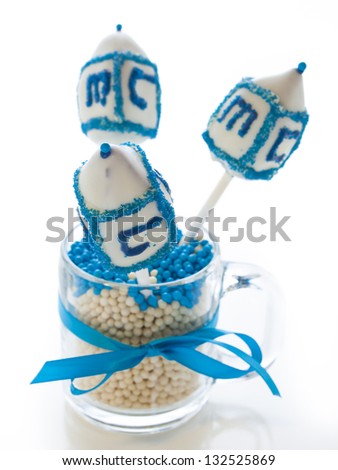 Gourmet dreidels decorated with white icing for Hanukkah.