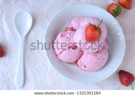 home make strawberry ice cream on white plate.