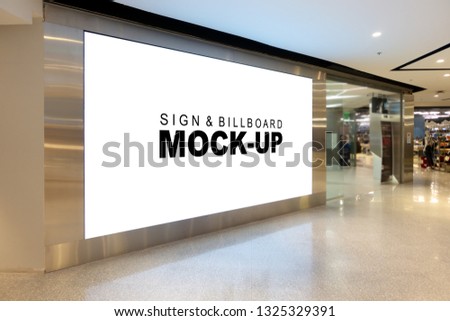 Mock up large billboard with clipping path at corridor, perspective white screen empty space for advertisement on the wall near walkway in the shopping mall