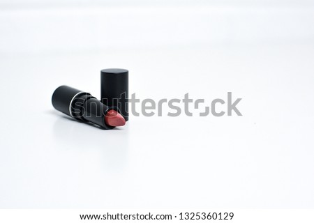 Beautiful and trendy photograph of generic beauty makeup on a white modern background. This stylish, high end, bright, and colorful product photograph is perfec for any fashion or makeup brands.