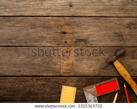 Set of old rusty tools on rustic wooden background with copy space in the middle, Fathers Day