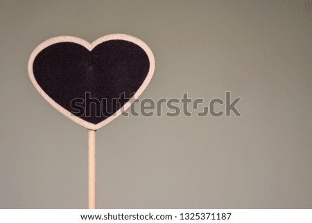 blurred image of Small blackboard with heart shape