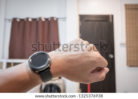 Black Smartwatch in man arm