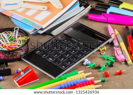 Back to school. Items for school activities rotate on the table.