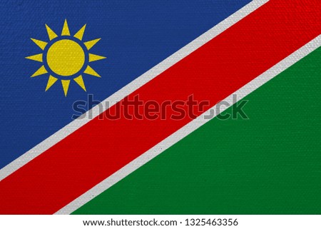 Namibia flag on canvas. Patriotic background. National flag of Namibia