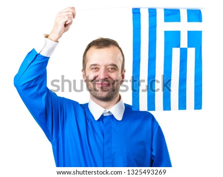 Happy joful man holding greek flag. Tourism, country presentation and promotion concept. Studio shot on white isolated background.