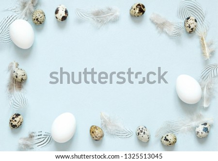 Frame with easter eggs and feathers. Happy Easter concept.