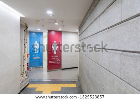 The sign shows entrance to the toilet in subway Seoul, South Korea.