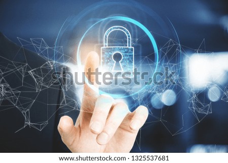 Hand holding abstract polygonal padlock interface on blurry background. Protection and web concept. Double exposure 