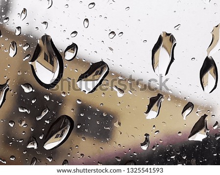 water rain drops on car glass window closeup macro shot