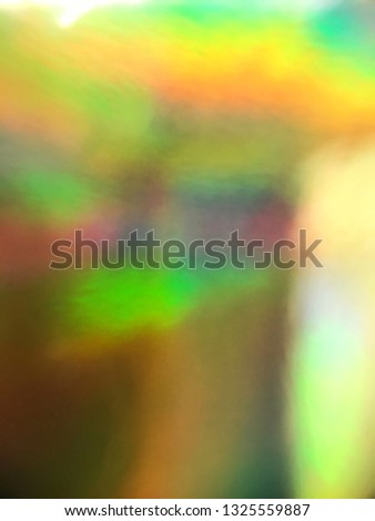 Holographic metallic foil with gradient vibrant colors.