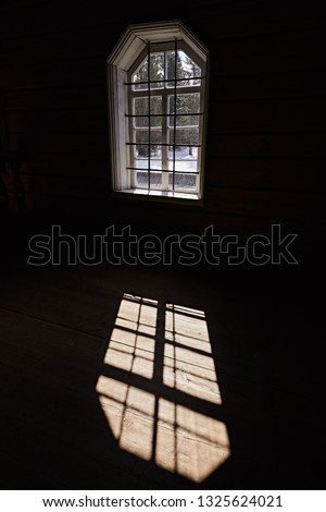 Bright light through one window, the play of light and shadow on the wooden floor. Abstract photography
