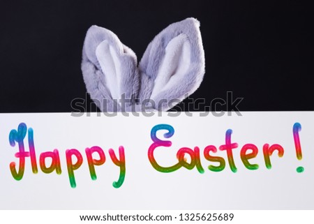 Happy Easter Banner with bunny ears behind him