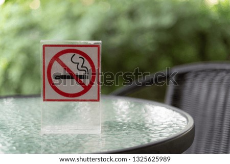 Don't smoke sign with bokeh background with shopping place