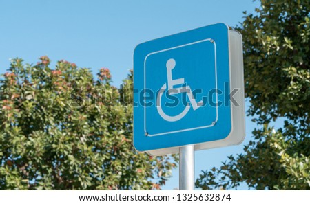 handicapped icon on the ground of car parking area reserve for disabled people in urban gas station, disability access healthcare