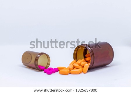 Medicine, Pills spilling out of pill bottle, Tablets, Necessary drugs, Silhouette white background.