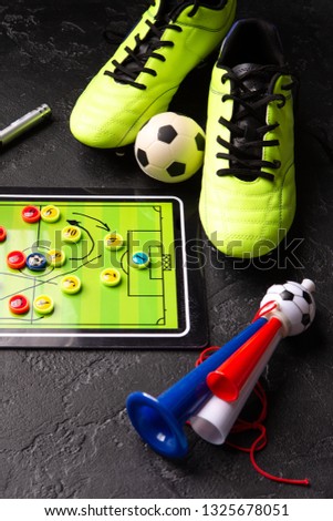 Photo of table football, soccer ball, boots, pipes