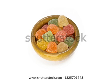 Small Cup Filled With Gummy Candies With Fruit Juice, Isolated On White Background