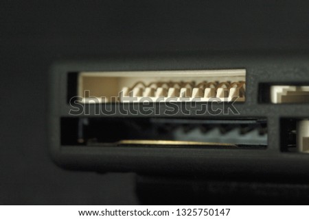 Card reader. Ports for various memory card formats closeup. Shallow depth of field