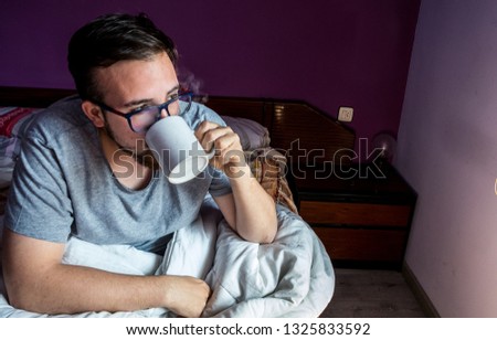 drinking coffee in bed, guy man with glasses with boiling cup