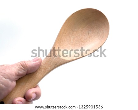Ladle in hand, isolated on white background