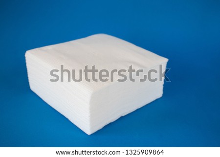 Pile of napkins on a blue background