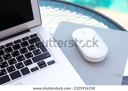 White computer mouse on the keyboard. Place for logo and text