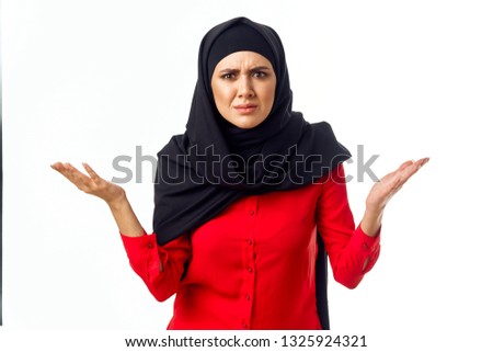  arab woman in black burqa on isolated background                              