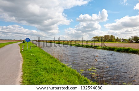 Irrigation Canal between the Fields of Tulips, Netherlands