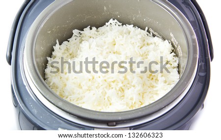 Stream rice in electric rice cooker isolated on a white background Royalty-Free Stock Photo #132606323