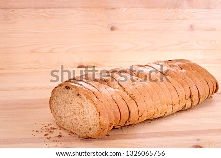 Bread lying on a wooden table, close-up
