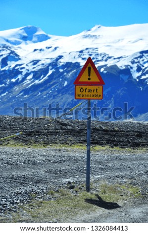 Impassable traffic signal, the end of an icelandic off road with the glacier Eyjafjallajokull in its background