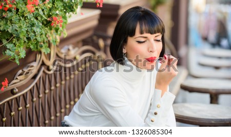 Girl relax cafe with cake dessert. Pleasant time and relaxation. Gourmet concept. Delicious gourmet cake. Woman attractive brunette eat gourmet cake cafe terrace background. Gastronomical enjoyment.
