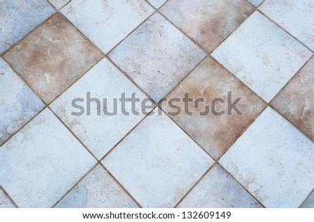 squared tiles of a patio floor